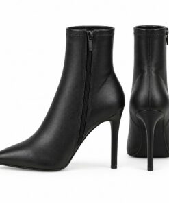 Pair of women's black stretch vegan leather sock ankle boots with stiletto heel standing, side profile and back heel view