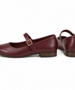 Pair of women's burgundy vegan leather Mary Jane flats standing, side profile and back heel view