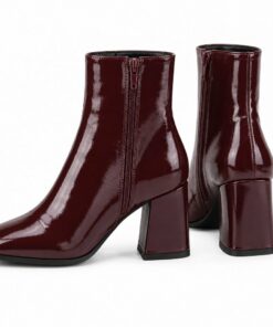 Pair of women's burgundy patent square toe ankle boots with block heel standing, side profile and back heel view