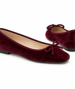Pair of women's burgundy velvet square toe ballet flats standing, side profile and back heel view