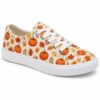 Single women's pumpkin print low-top canvas sneaker on a white background