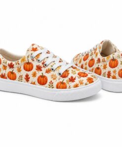 Pair of women's pumpkin print low-top canvas sneakers standing, side profile and back heel view