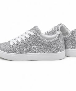 Pair of women's silver glitter low-top sneakers standing, side profile and back heel view