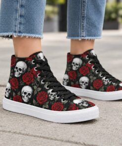 Woman wearing black skull and rose print high-top canvas sneakers on a city sidewalk, cropped from the knees down