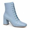 Single women's sky blue vegan leather lace-up ankle boot with block heel on a white background